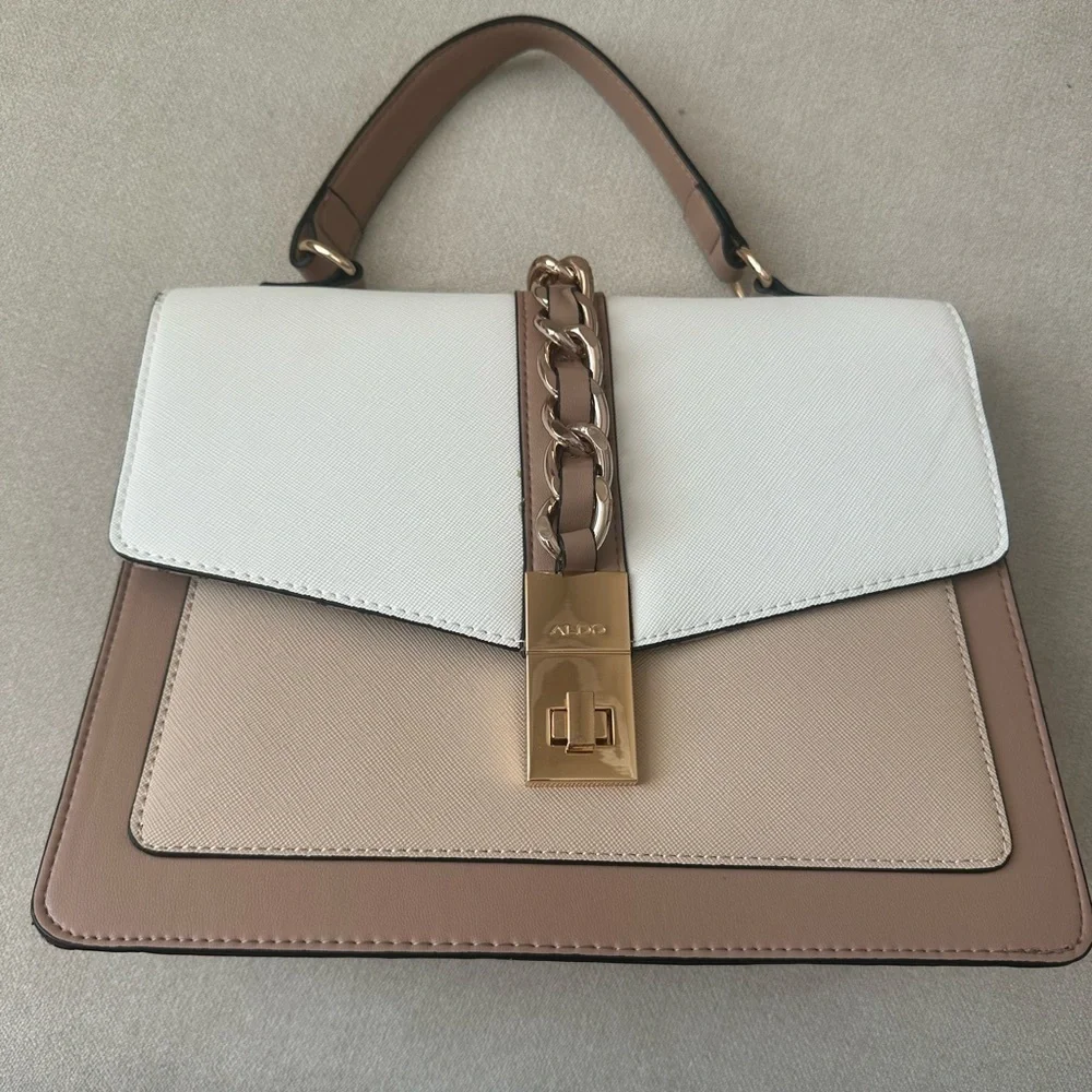 ALDO women's handbag with a top handle and chain detail.